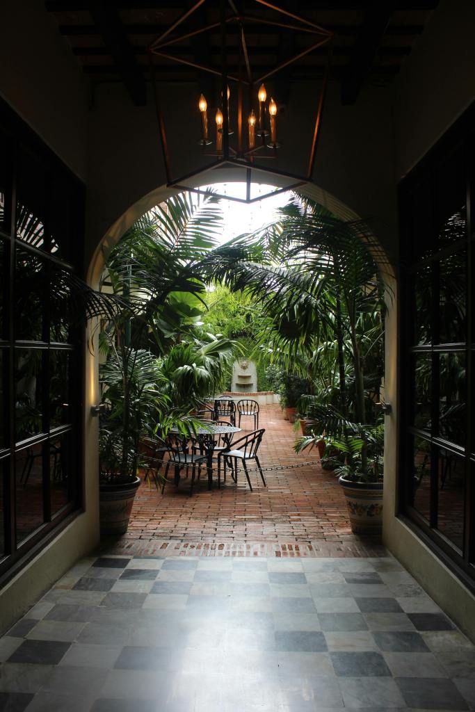 tiled arched passage leading to floral garden